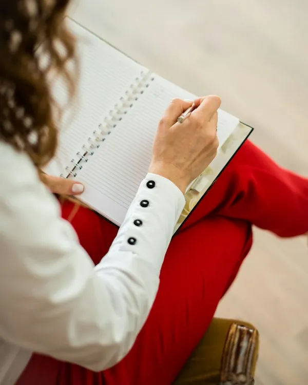 Taking notes during a session at the practice